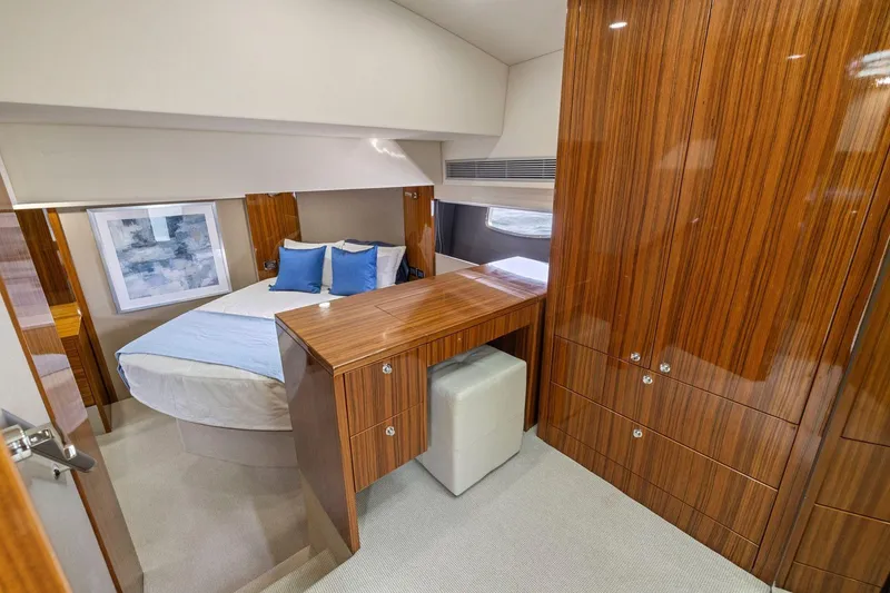 Slide: The Image of Luxurious 2014 Maritimo M50 yacht cabin with elegant wood finish and cozy bedding. - 57