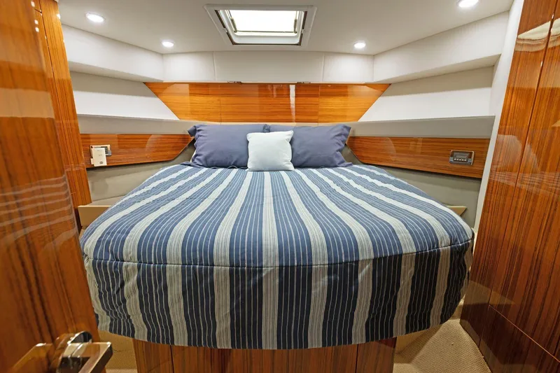Slide: The Image of Luxurious cabin interior of 2014 Maritimo M50 yacht with striped bedding. - 70