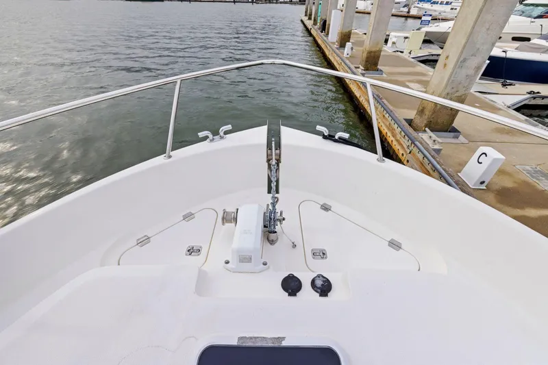 Slide: The Image of Bow view of 2014 Maritimo M50 yacht docked at marina. - 79