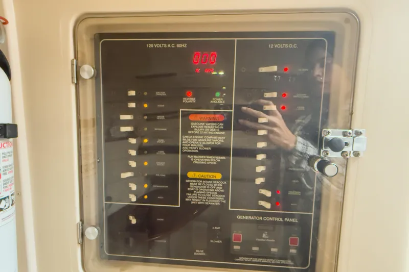 Slide: The Image of Electrical control panel on a 2006 Grady-White Express 330 boat. - 14