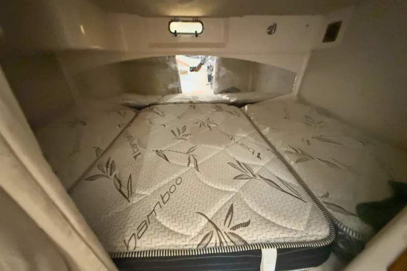 Slide: The Image of 2006 Grady-White Express 330 cabin with bamboo-patterned mattress. - 23