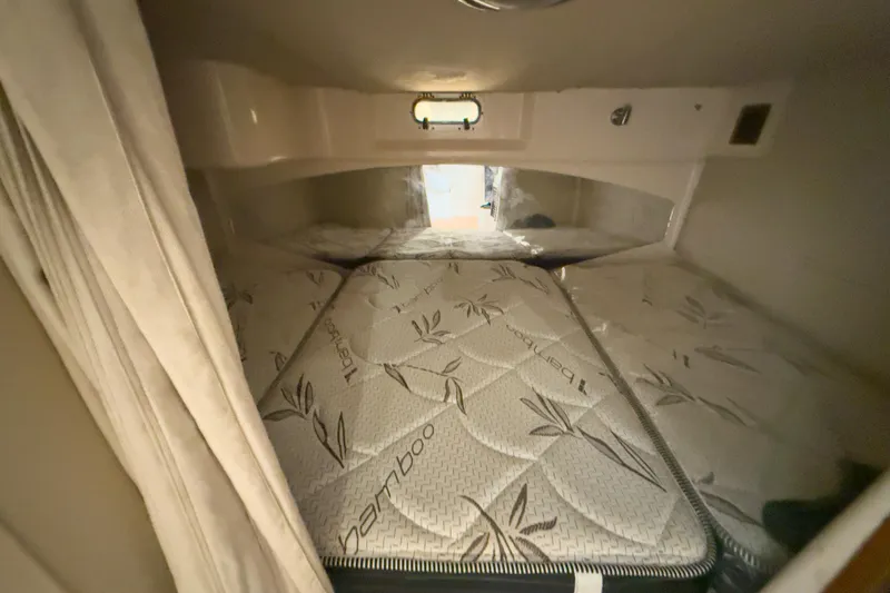 Slide: The Image of 2006 Grady-White Express 330 cabin interior with bamboo-patterned mattress. - 24
