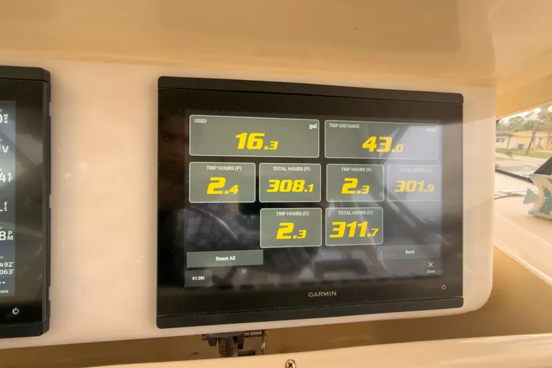 Slide: The Image of Garmin display on 2006 Grady-White Express 330 showing trip data and fuel usage. - 28