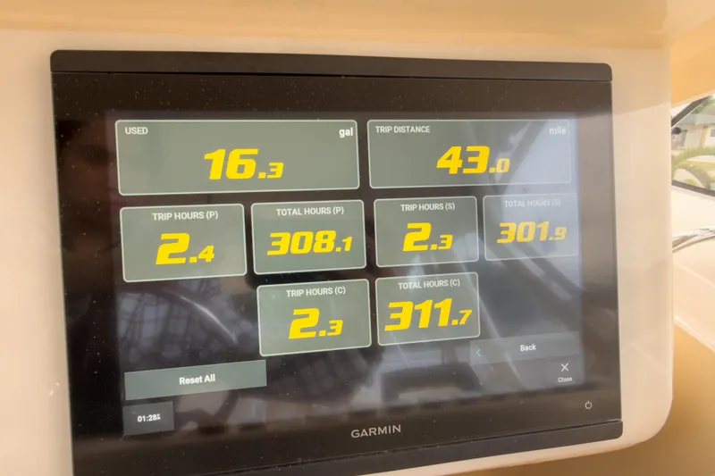 Slide: The Image of Garmin display showing fuel usage and trip data on 2006 Grady-White Express 330 boat. - 29