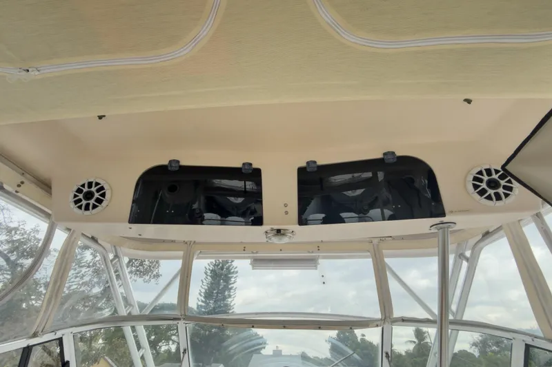 Slide: The Image of 2006 Grady-White Express 330 boat interior with speakers and windows. - 39