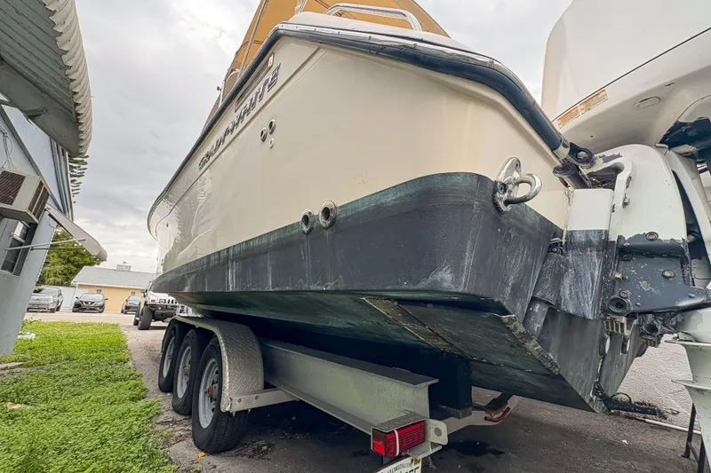 Slide: The Image of 2006 Grady-White Express 330 boat on trailer, side view, parked outdoors. - 46