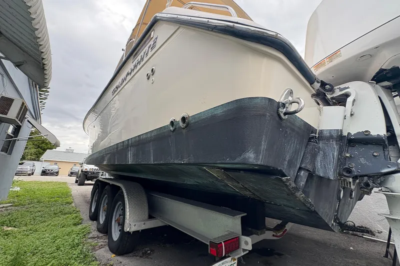 Slide: The Image of 2006 Grady-White Express 330 boat on trailer, side view, parked outdoors. - 8