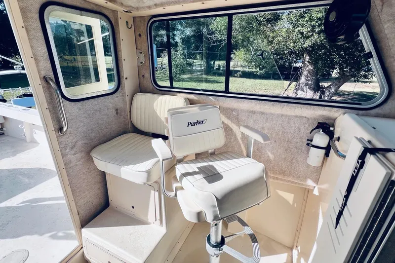 Slide: The Image of 2005 Parker 2820 XLD Sport Cabin interior with seating and window view. - 11