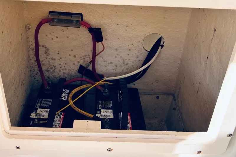 Slide: The Image of Battery compartment of 2005 Parker 2820 XLD Sport Cabin with wiring and connections. - 12