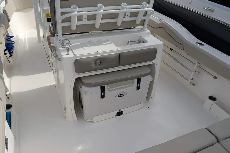 Slide: The Image of 2023 Key West 263 FS boat interior with seating and storage features. - 10