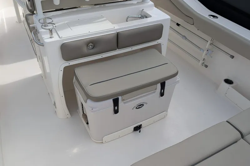Slide: The Image of 2023 Key West 263 FS boat interior with seating and storage area. - 11