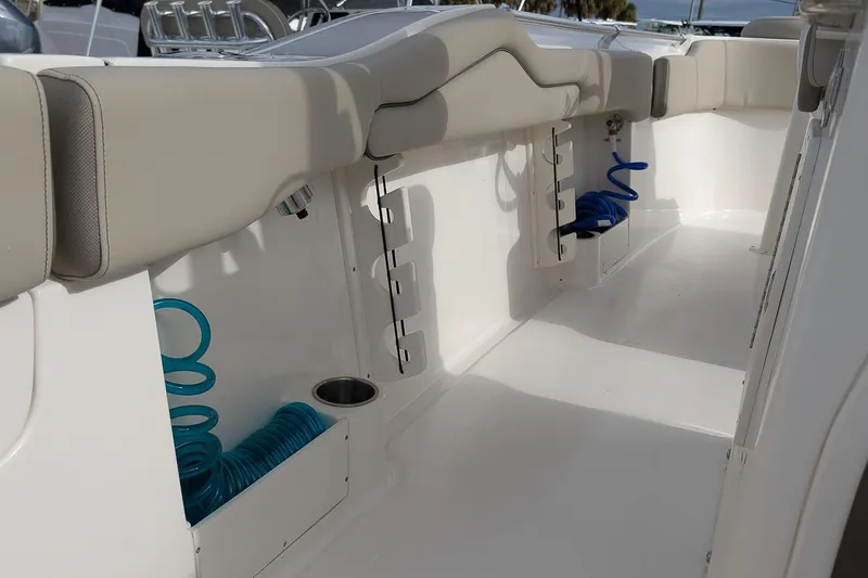 Slide: The Image of 2023 Key West 263 FS boat interior with seating and storage compartments. - 12