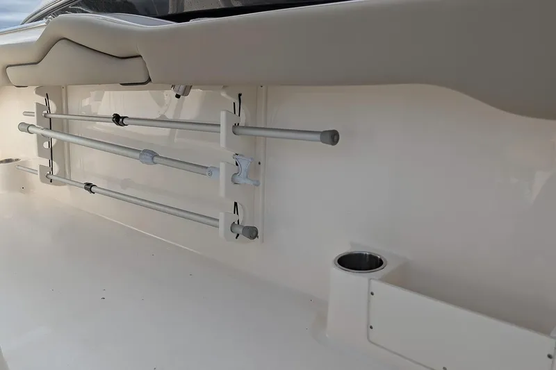 Slide: The Image of 2023 Key West 263 FS boat interior with rod holders and cup holder. - 13