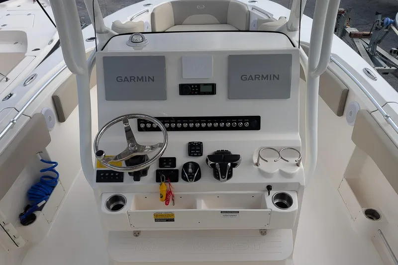 Slide: The Image of 2023 Key West 263 FS boat dashboard with Garmin navigation system and steering wheel. - 15