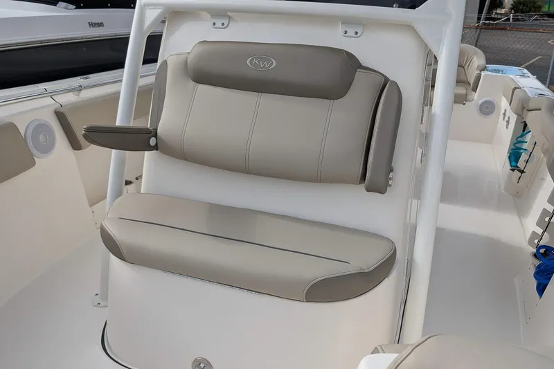 Slide: The Image of 2023 Key West 263 FS boat interior with beige seating and armrest. - 20