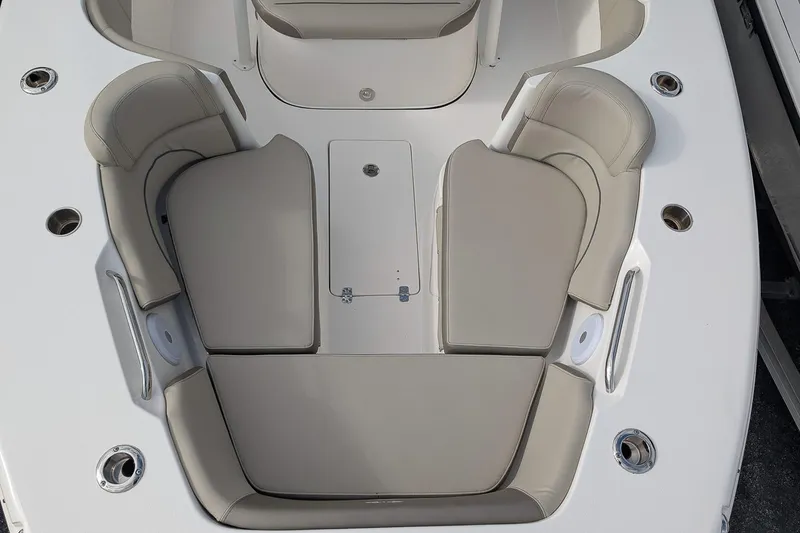 Slide: The Image of 2023 Key West 263 FS boat interior with beige seating and stainless steel fixtures. - 21