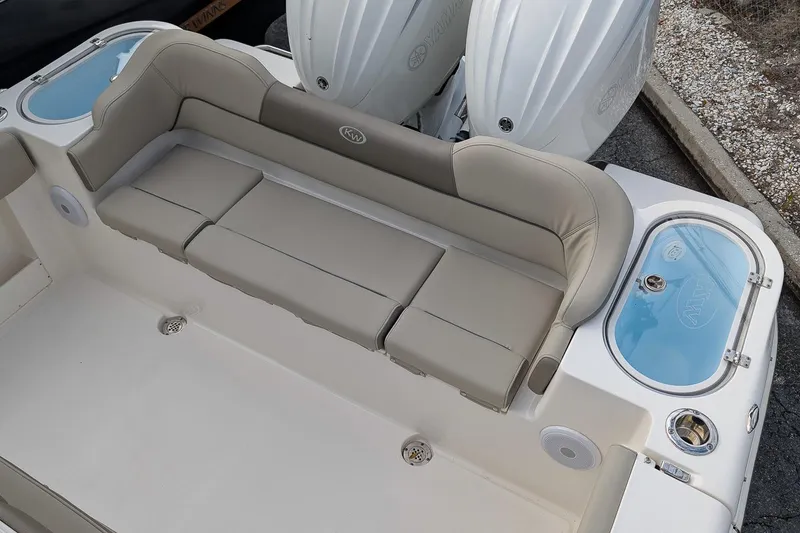 Slide: The Image of 2023 Key West 263 FS boat with cushioned seating and dual outboard motors. - 8