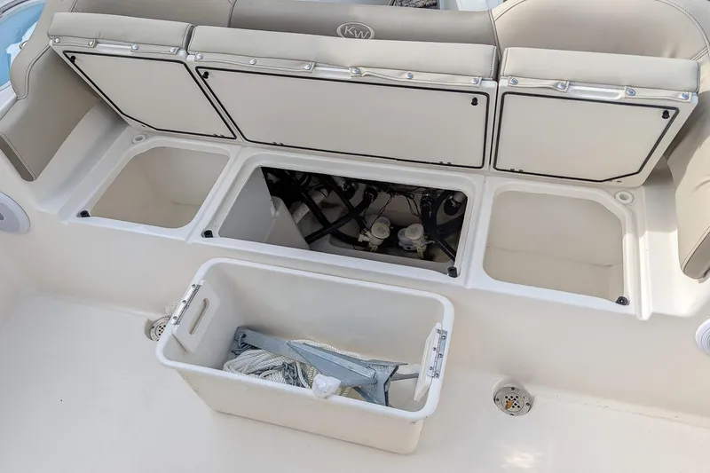 Slide: The Image of 2023 Key West 263 FS boat storage compartments and seating area. - 9