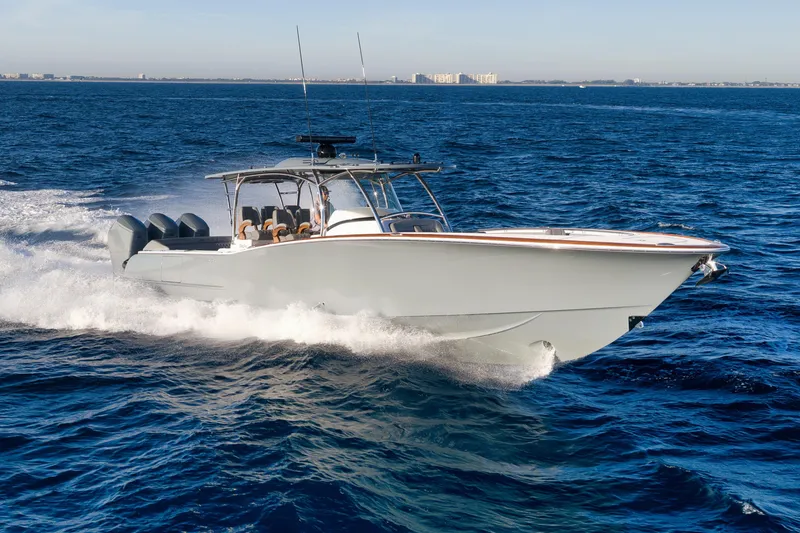 The Image of 2026 Mag Bay 43 CC cruising on open ocean, showcasing sleek design and powerful performance. - 0