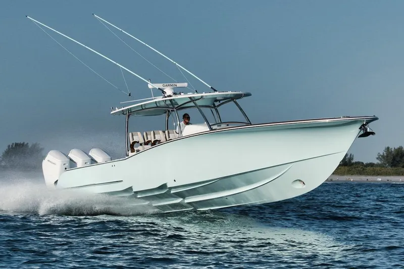 Slide: The Image of Manufacturer Provided Image: 2025 Mag Bay 43 CC boat cruising on open water, showcasing sleek design and powerful engines. - 1