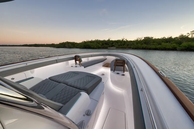 Slide: The Image of Luxurious 2026 Mag Bay 43 CC boat interior with elegant seating and scenic water view. - 11