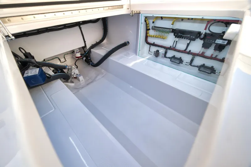 Slide: The Image of 2026 Mag Bay 43 CC boat interior wiring and storage compartment. - 19
