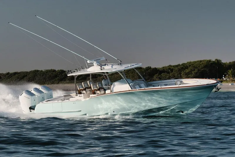 Slide: The Image of Manufacturer Provided Image: 2025 Mag Bay 43 CC boat cruising on water with triple outboard engines. - 5