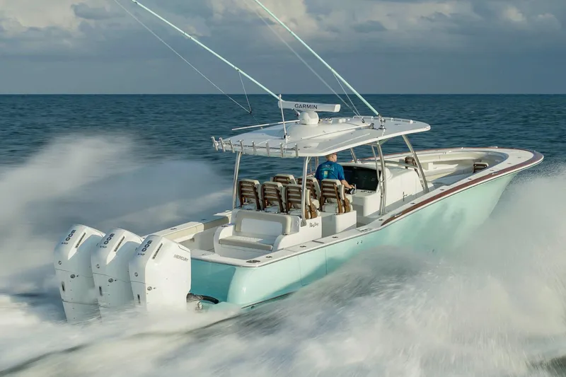 Slide: The Image of Manufacturer Provided Image: 2025 Mag Bay 43 CC boat cruising on open water with powerful engines. - 6