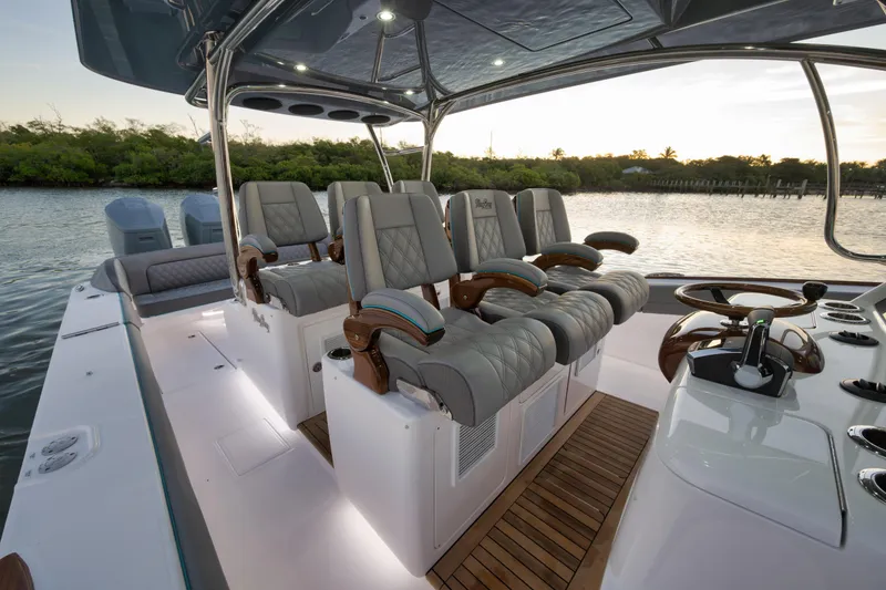 Slide: The Image of Luxurious interior of 2026 Mag Bay 43 CC boat with plush seating and modern controls. - 9