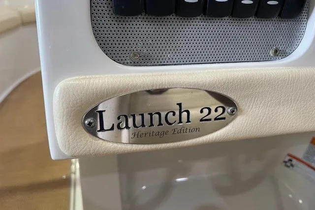 Slide: The Image of 2011 Chris-Craft Launch 22 Heritage Edition nameplate on boat dashboard. - 12
