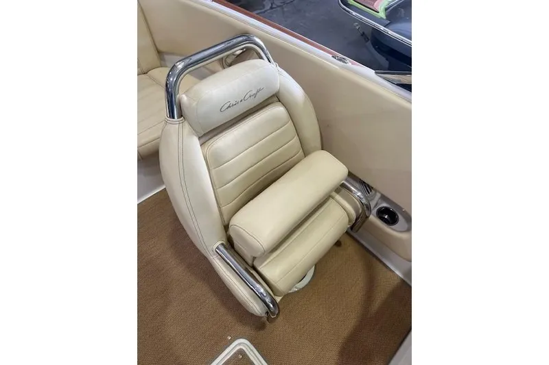 Slide: The Image of Luxurious beige seat in 2011 Chris-Craft Launch 22 boat with chrome accents. - 14