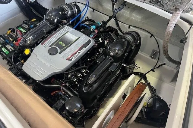 Slide: The Image of Engine compartment of a 2011 Chris-Craft Launch 22 boat, featuring a 350 MAG engine. - 24