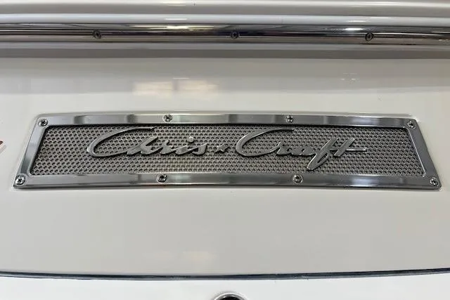 Slide: The Image of 2011 Chris-Craft Launch 22 logo on a metallic nameplate. - 27