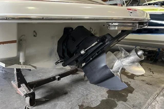 Slide: The Image of 2011 Chris-Craft Launch 22 boat propeller and stern view in a garage setting. - 7