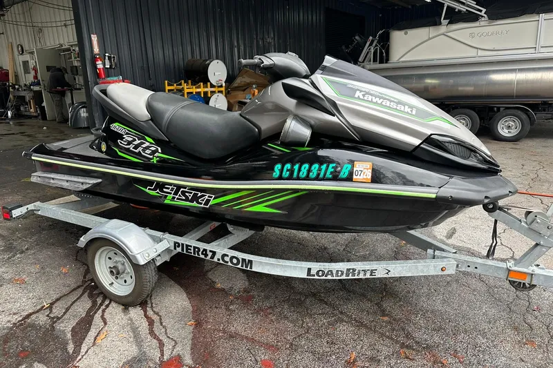 Slide: The Image of 2016 Kawasaki Jetski Ultra 310LX on trailer, parked in a garage setting. - 3