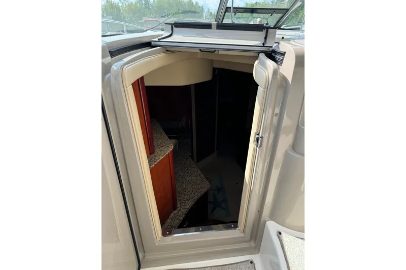 Slide: The Image of 2006 Sea Ray 38 Sundancer cabin entrance with open door, showing interior details. - 15
