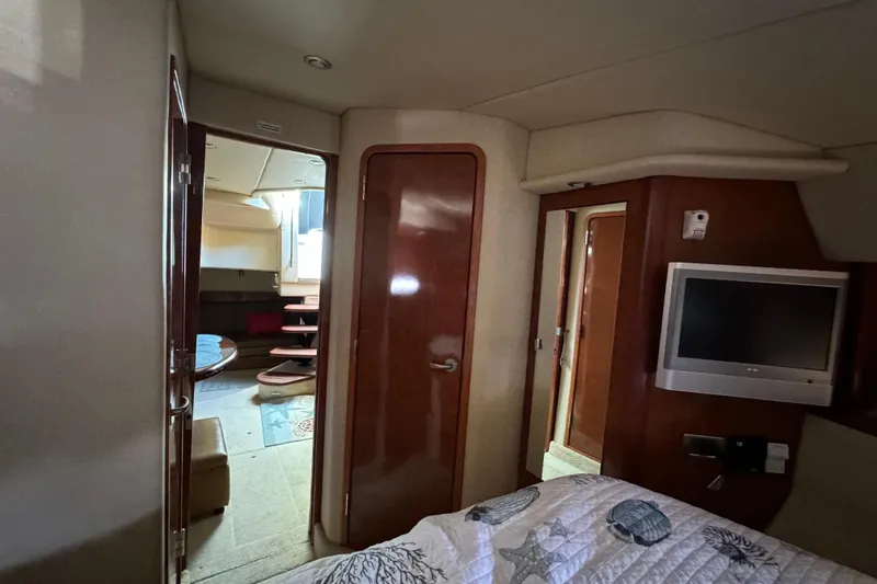 Slide: The Image of Interior of 2006 Sea Ray 38 Sundancer yacht with cozy cabin and TV. - 23