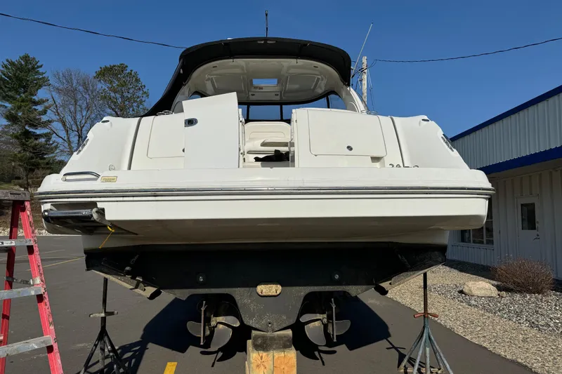 Slide: The Image of 2006 Sea Ray 38 Sundancer yacht on dry dock, rear view, sunny day. - 8