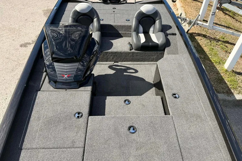 Slide: The Image of 2026 Vexus Defender 181 boat interior with dual seats and storage compartments. - 10