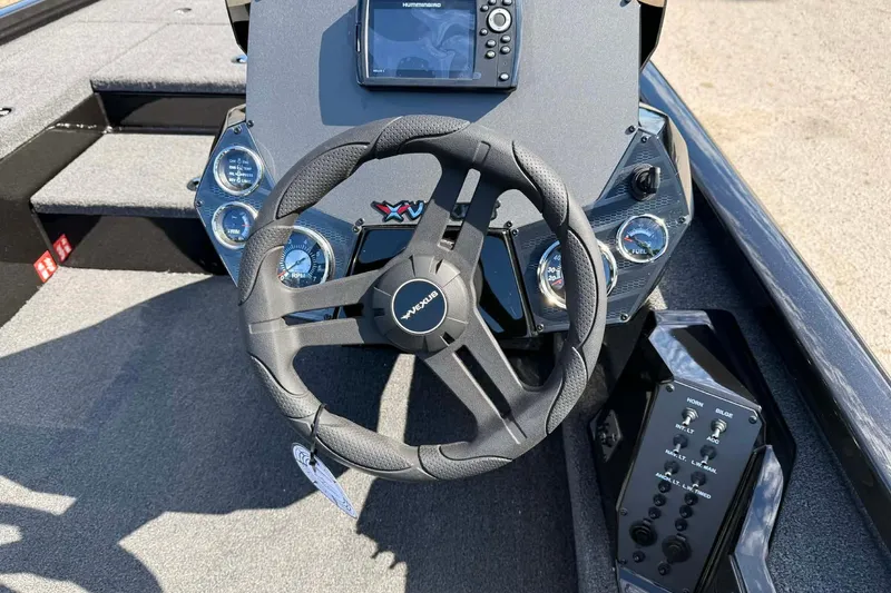 Slide: The Image of Steering wheel and dashboard of 2026 Vexus Defender 181 boat with control panel. - 3