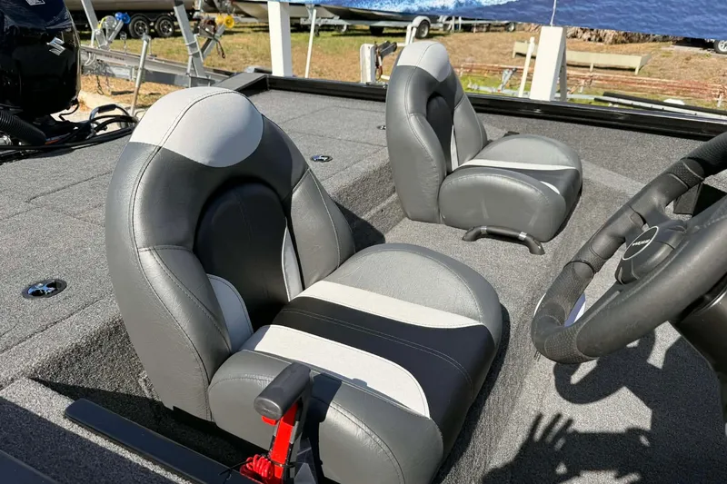 Slide: The Image of 2026 Vexus Defender 181 boat interior with gray and black seating. - 5