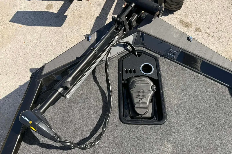 Slide: The Image of 2026 Vexus Defender 181 boat deck with trolling motor and foot pedal controls. - 7