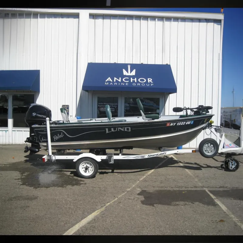 The Image of 1999 Lund 1440-V Rebel Tiller boat at Anchor Marine Group. - 0