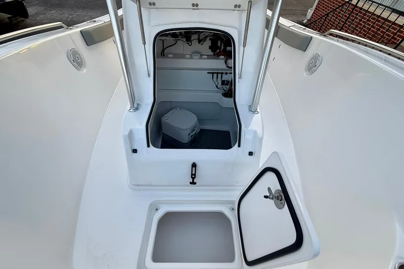 Slide: The Image of 2026 Cape Horn 22 OS boat interior with storage compartments and marine equipment. - 6