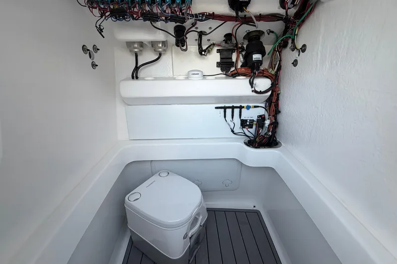 Slide: The Image of Interior of 2026 Cape Horn 22 OS boat showing wiring and compact toilet. - 7
