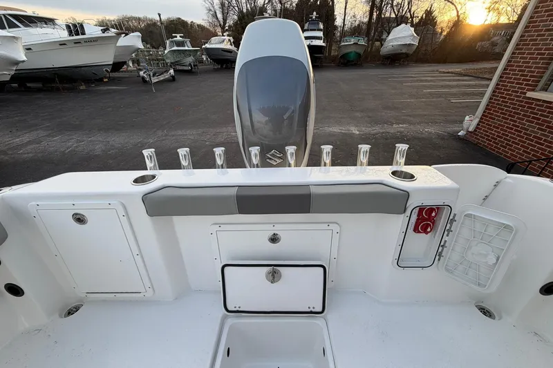 Slide: The Image of 2026 Cape Horn 22 OS boat interior with rod holders and storage compartments. - 8