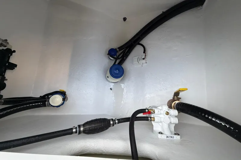 Slide: The Image of Interior view of 2026 Cape Horn 22 OS boat showing engine compartment components. - 13