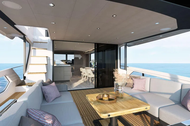 Slide: The Image of Luxurious 2026 Absolute 58 Navetta yacht interior with elegant seating and ocean view. - 6