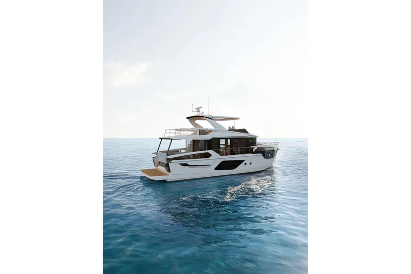 Slide: The Image of 2026 Absolute 58 Navetta yacht cruising on calm blue ocean waters. - 3