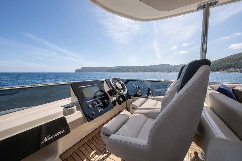 Slide: The Image of Luxurious helm of 2026 Absolute Navetta 58 yacht with scenic ocean view. - 24